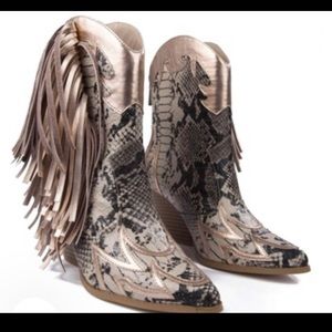 A lit pair of cowboy boots👢